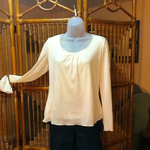 Cream colored long sleeved top